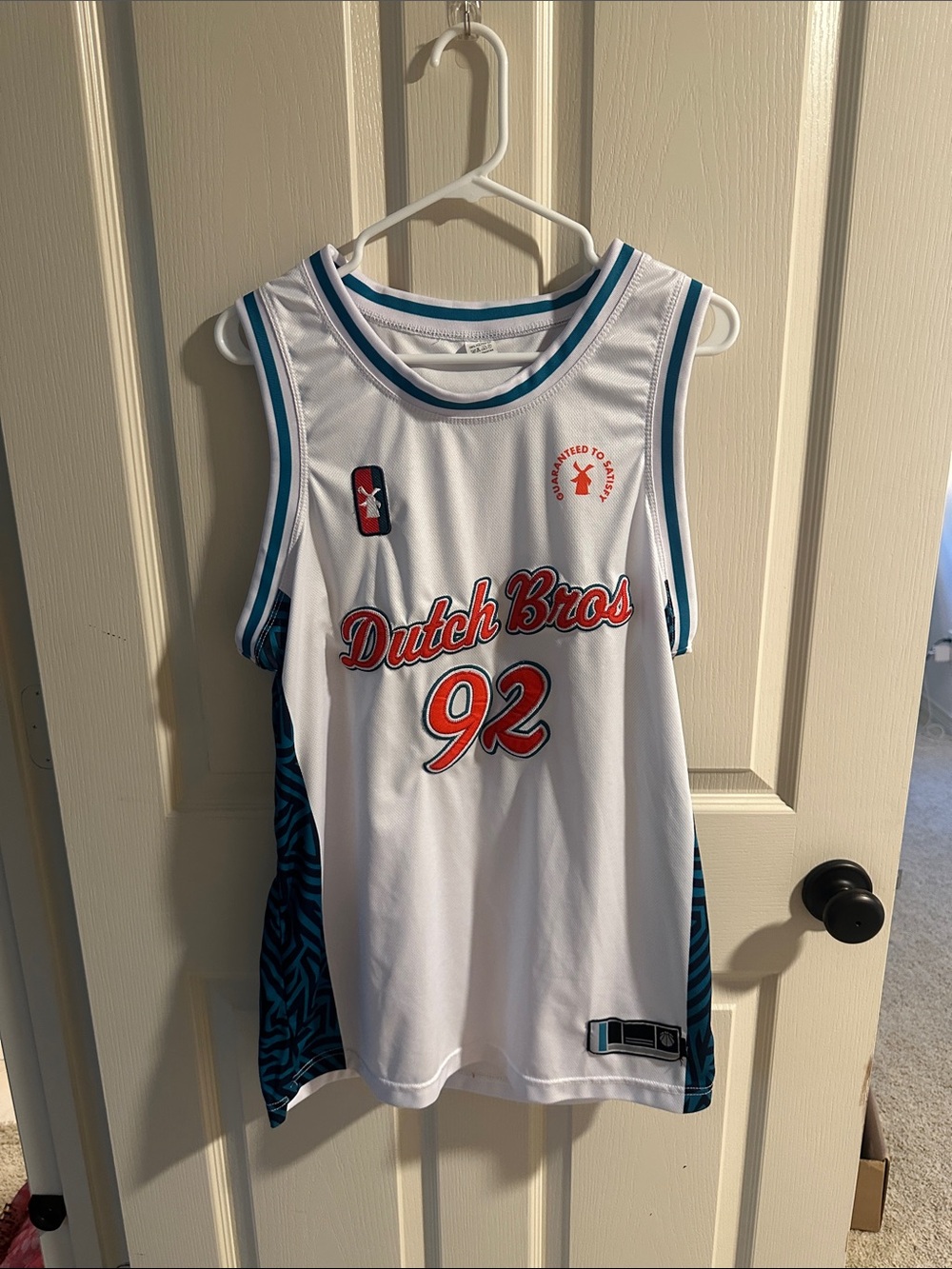 Dutch Bros White Jersey with Teal and Red Accents